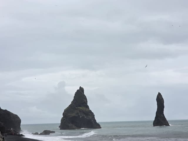 The Reynisdrangar sea stacks off the black sand beach