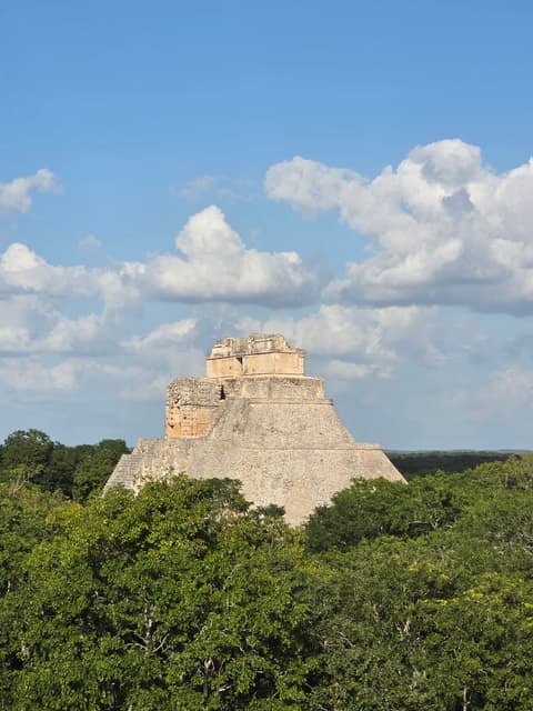 The Uxmal pyramid rising above the jungle canopy